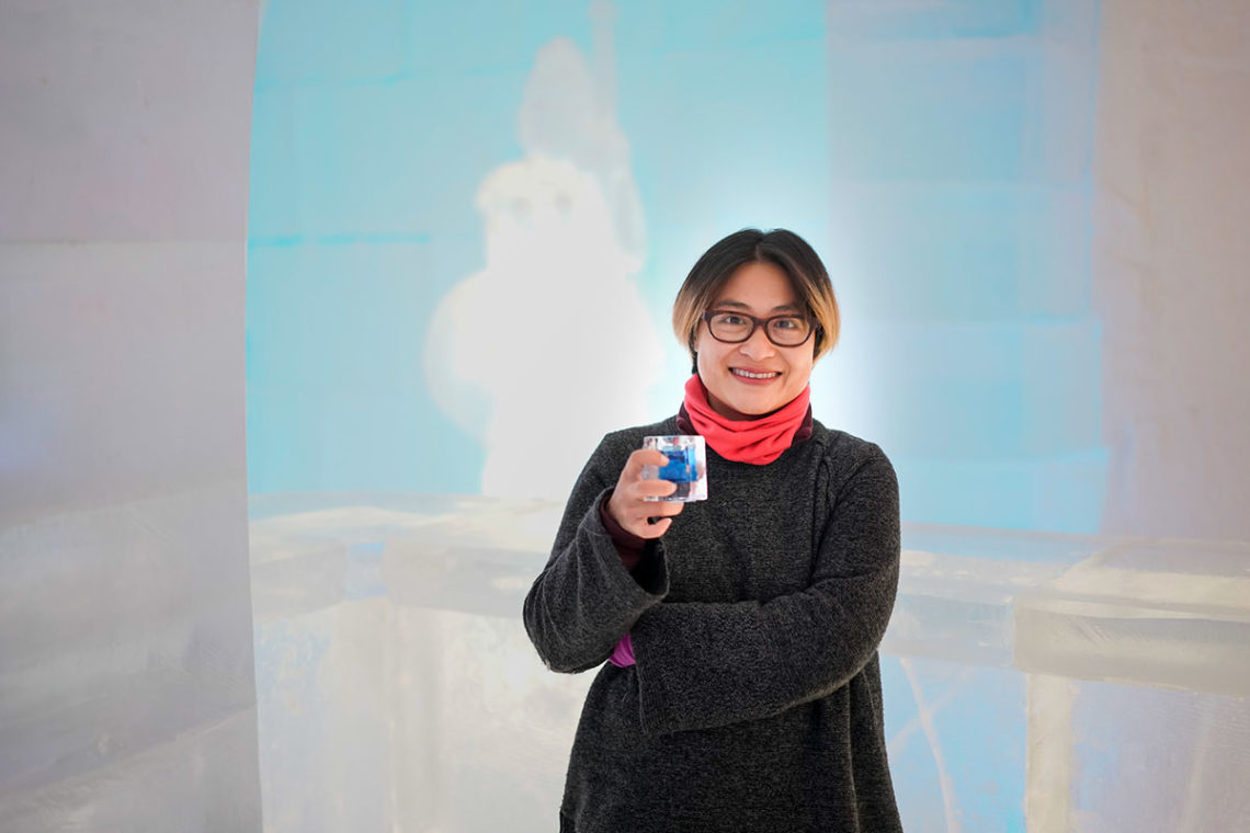 Asian woman drink cocktail in ice hotel